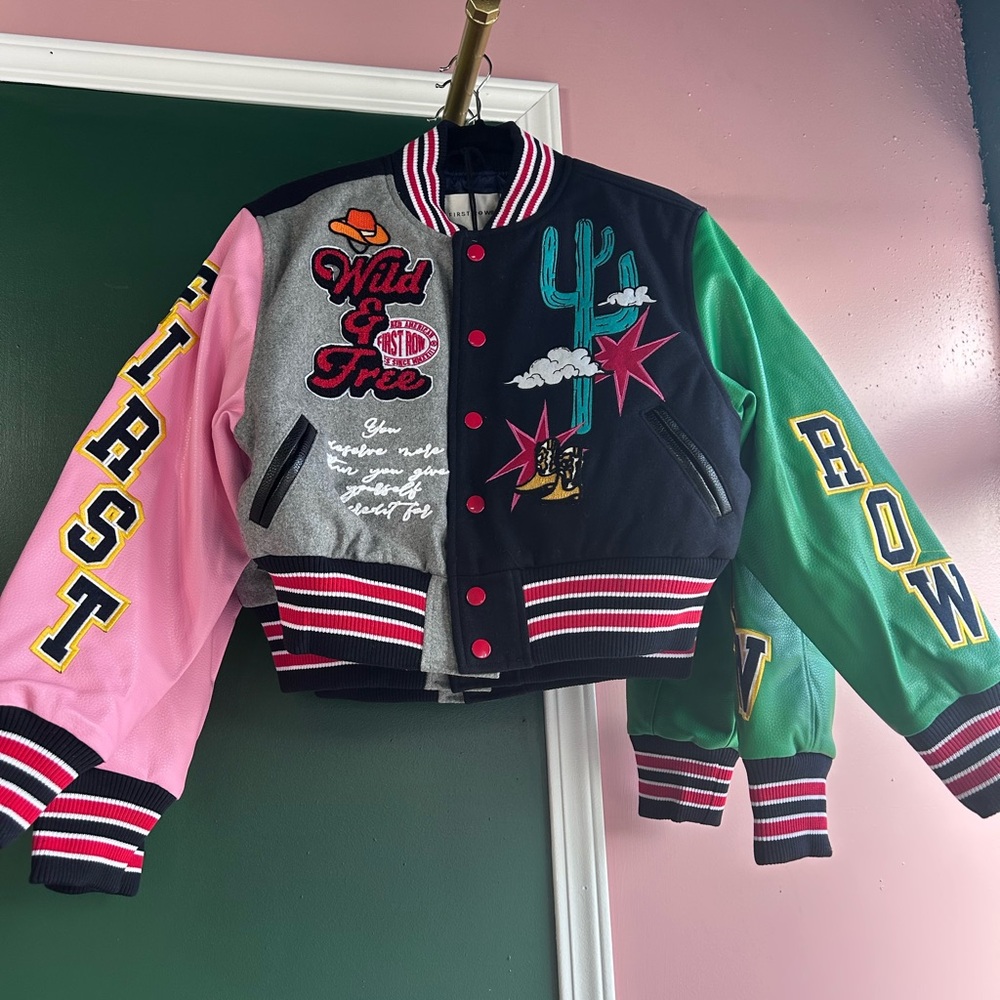 Woman’s green/black varsity jacket
